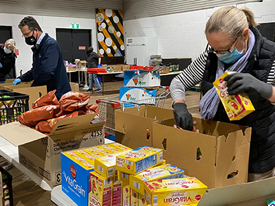 Randwick City Mayor, Danny Said, helped pack food boxes with volunteers at Addi Road.