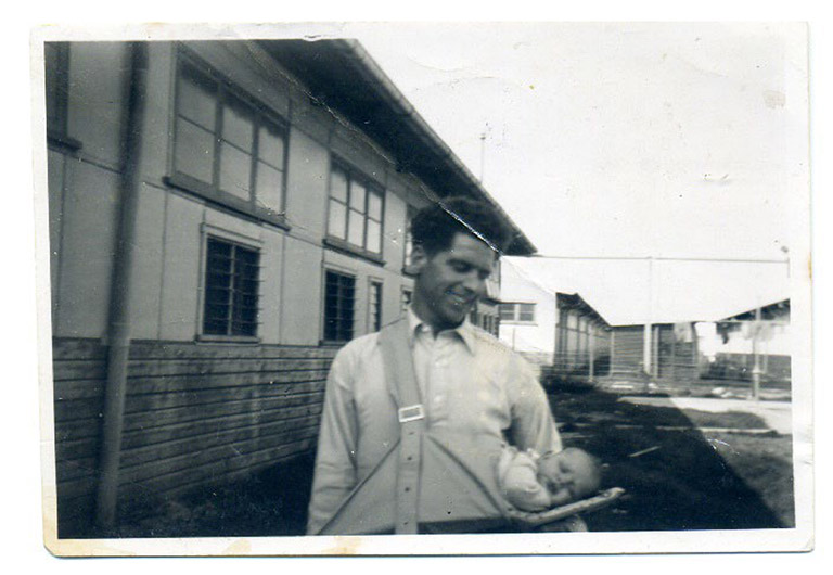 Gordon James Choake holding his baby daughter Marilyn Wilson at Bunnerong Migrant Hostel 1951-1953. Gordon went on to work at Bunnerong Power Plant. (Marilyn Wilson Collection: Randwick City Library).