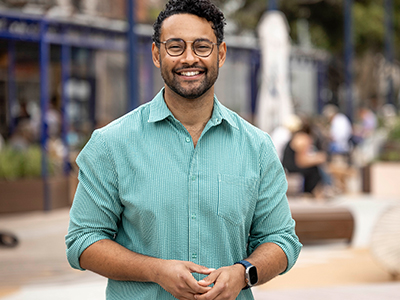 A headshot of Mayor Dylan Parker, smiling warmly into camera