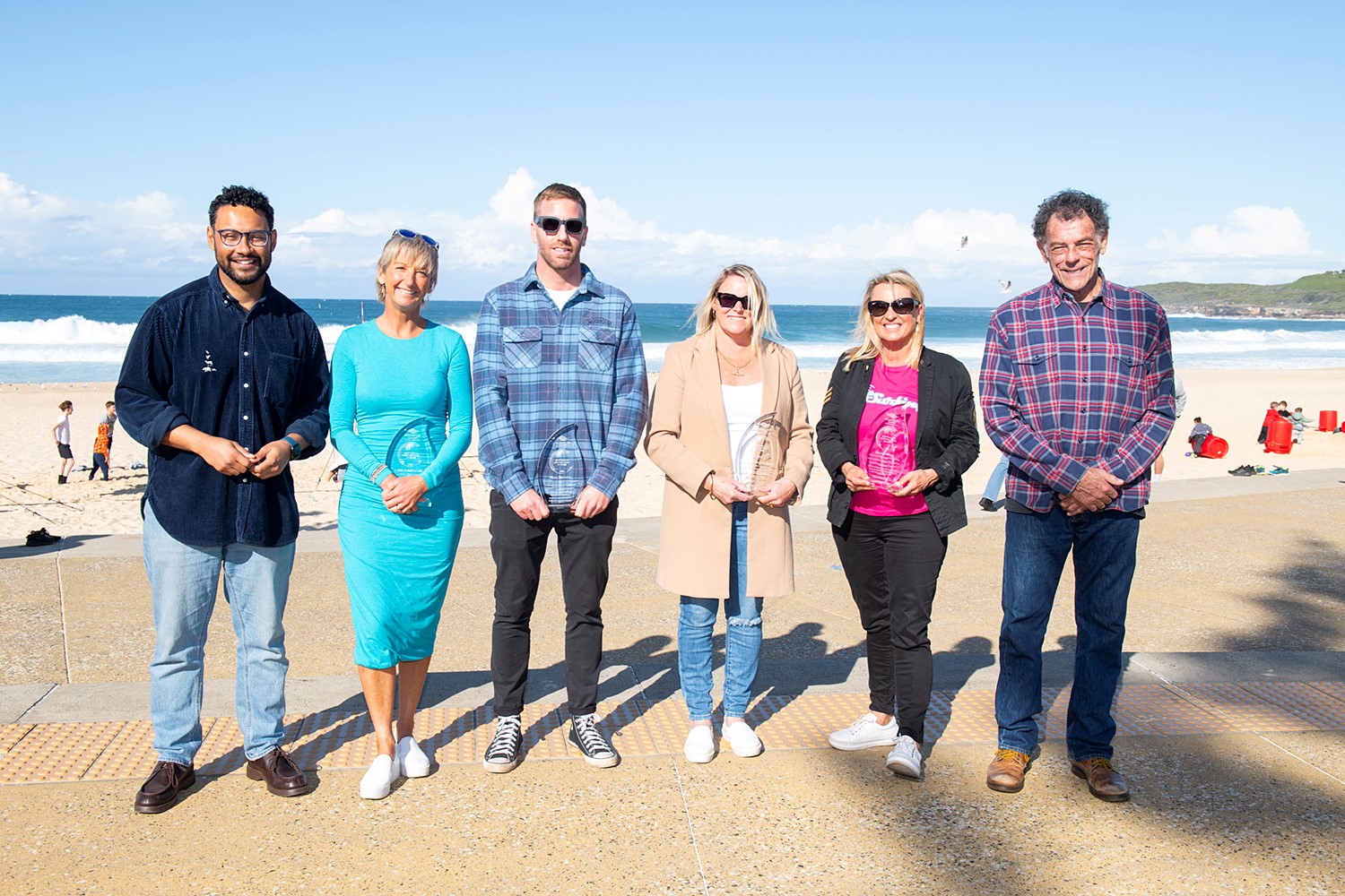 The 2023 Australian Surfing Walk of Fame inductees Layne Beachley AO, Blake Thornton, Linda McGuigan (nee Hardy) and Brenda Miles. Pictured with Randwick City Council Mayor Dylan Parker and MC Mike Whitney AM.