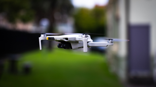 A picture of a drone hovering above the ground