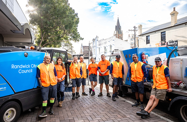 Randwick Council staff across multiple departments will coordinate their teams into a single operation and 'Blitz' team. Council members of the Blitz team pose in front of trucks