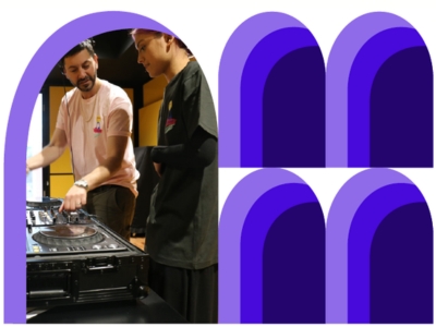A photograph of two people DJing