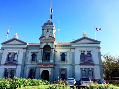 Randwick Town Hall with the French flag at half mast.