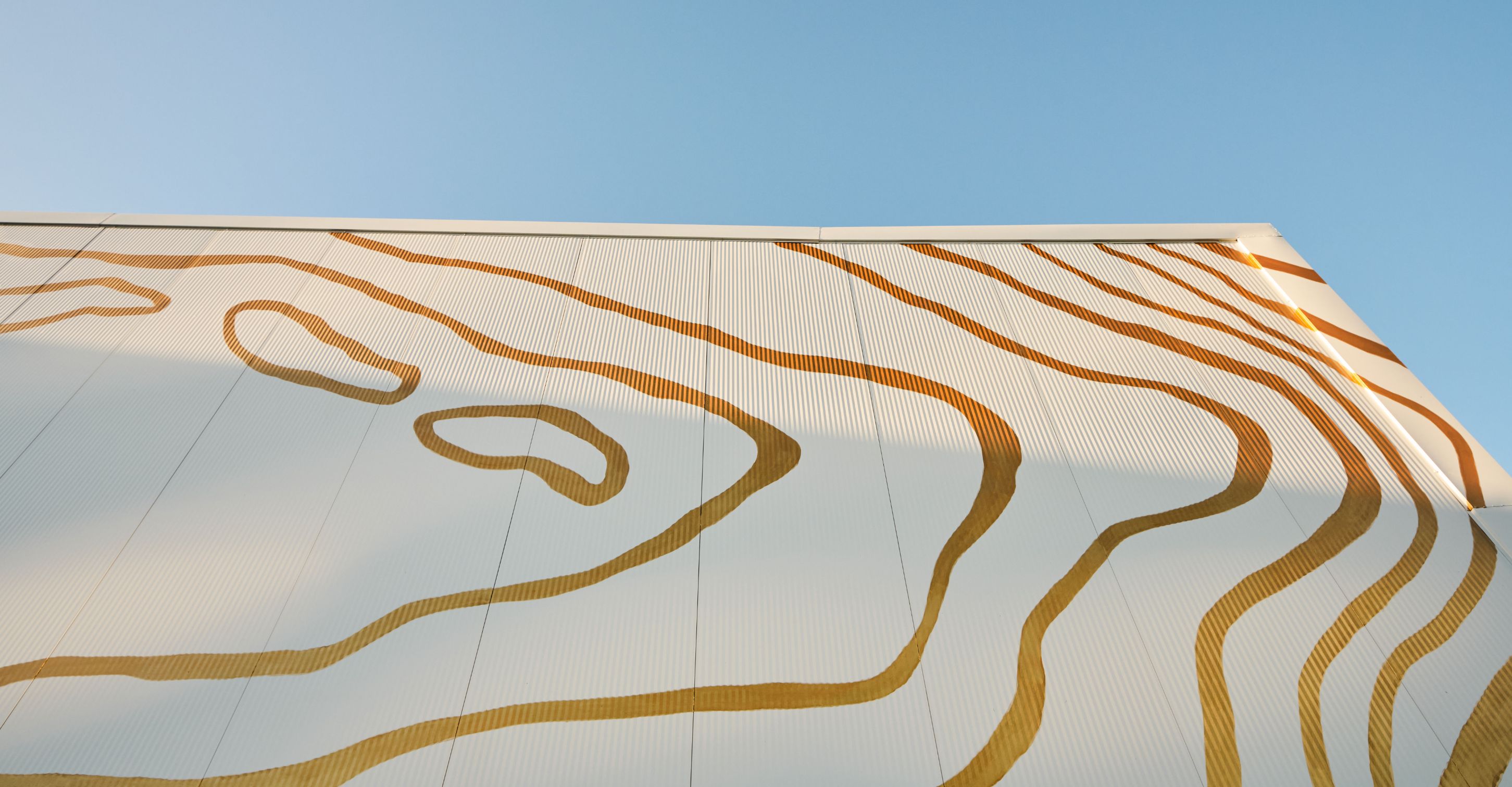 Golden motifs wrap around the building's exterior.