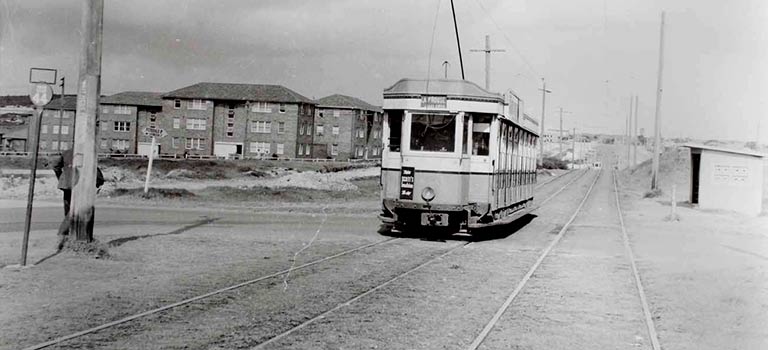 An old tram passes the housing estate along Anzac Parade c1961, Courtesy: Vic Solomon Collection, Randwick City Library.