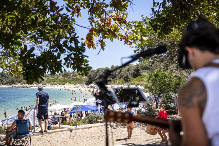 Musician Playing Infront of Ocean