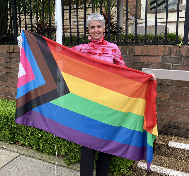 Mayor of Randwick, Cr Philipa Veitch holding the Progress Pride Flag 2024.