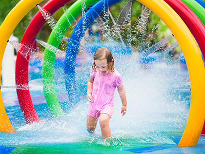 Child plays in splash park