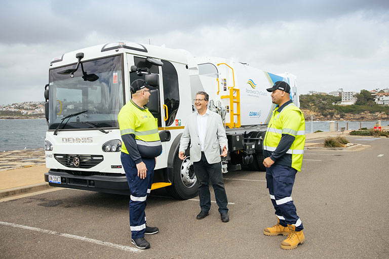 Mayor Danny Said with Cleanaway staff and the new fleet of garbage trucks.