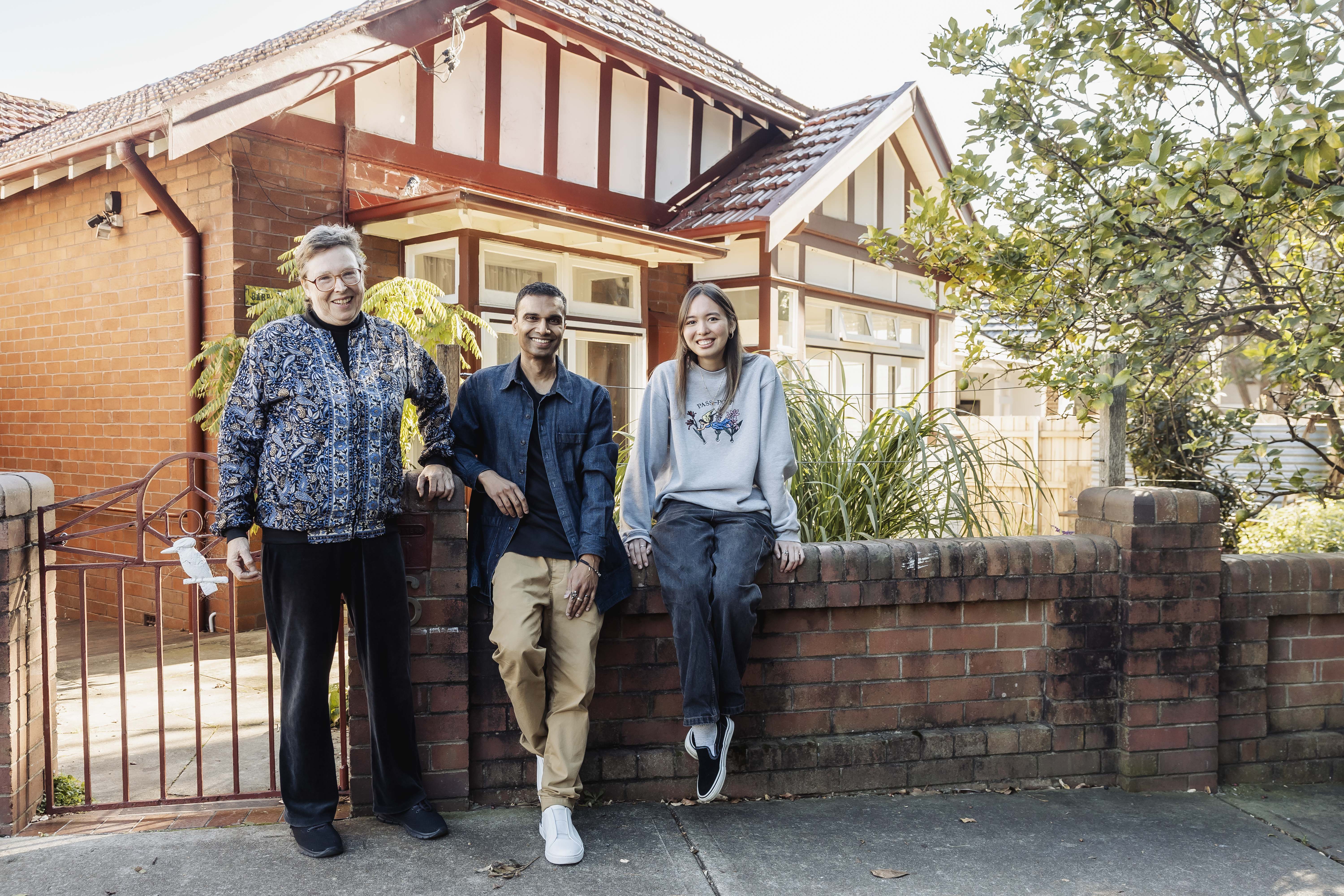 3 artists in front of Barrett House